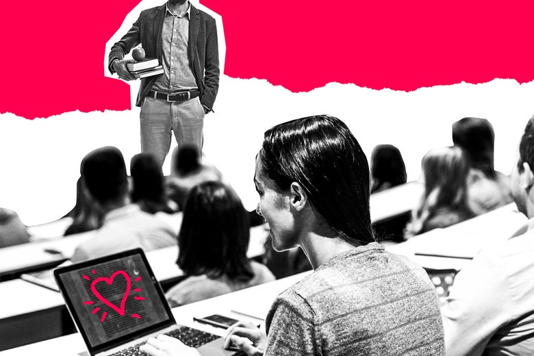 A woman sits in a college class with a heart shape on her laptop.